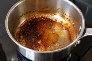 How to Clean a Burnt Stainless Steel Pan: 5 Easy Methods 2 Burnt caramelized sugar inside a stainless steel pan